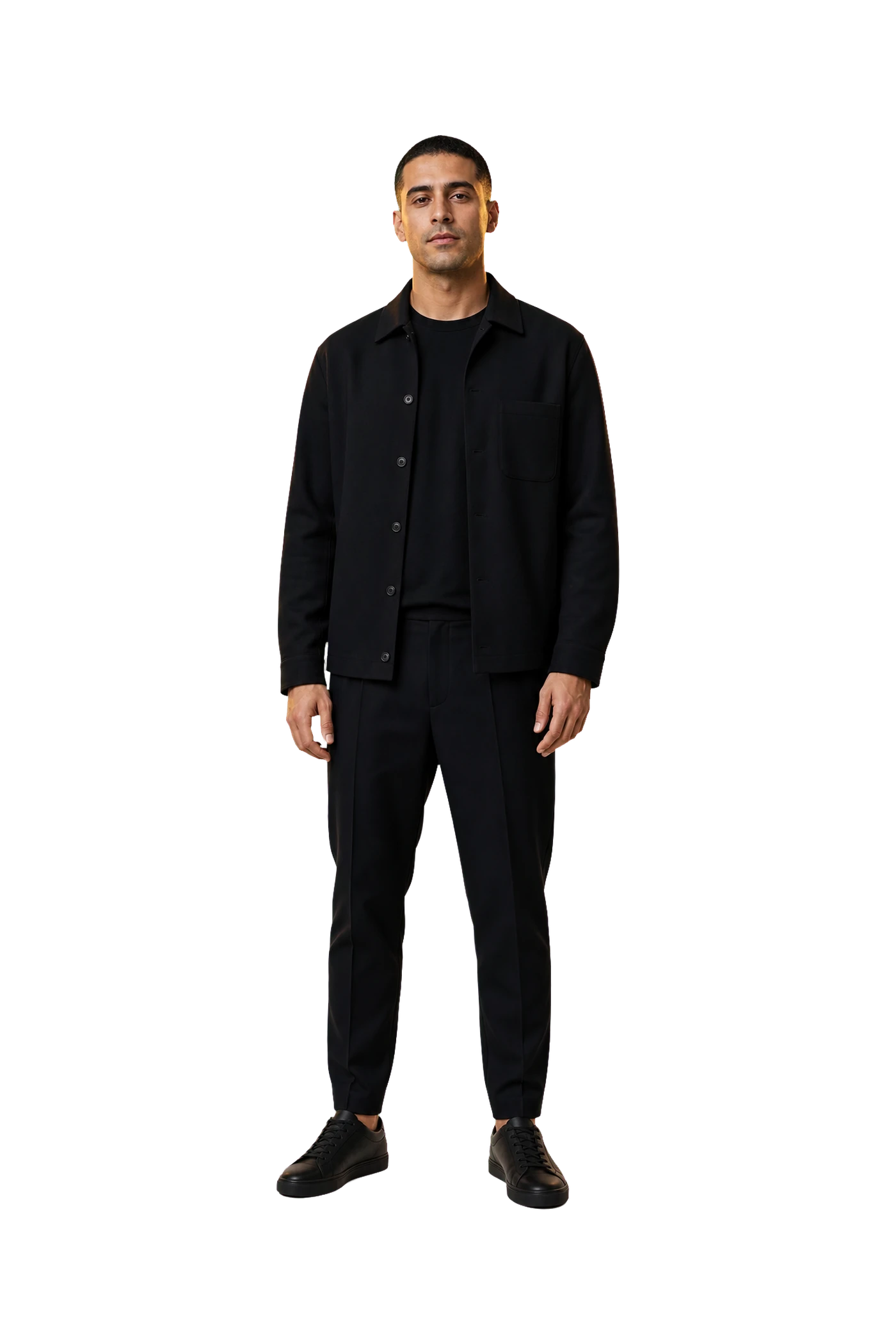 Fictional music producer standing in a recording studio.